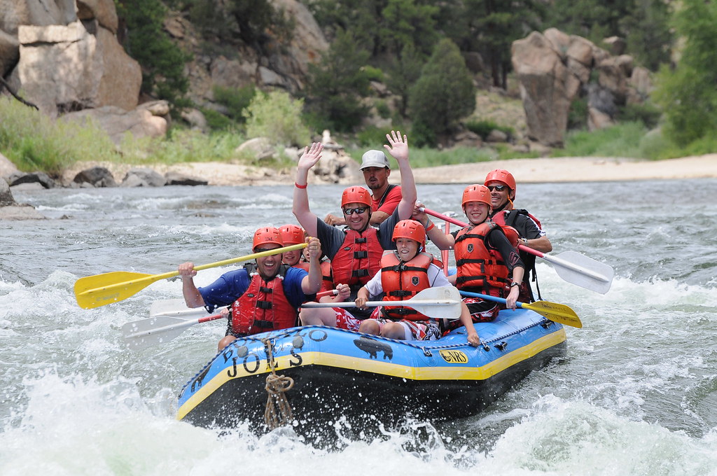 Group of people enjoying river rafting in Rishikesh, India